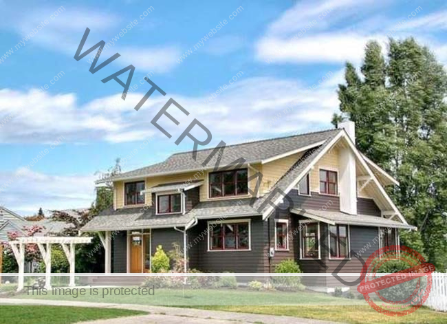 A natural brown house with a large front yard and a fireplace. 