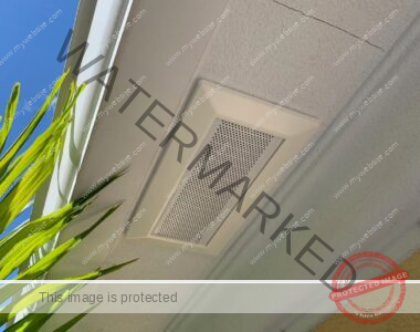 The attic ventilation soffit is installed below the ridge of the roof.