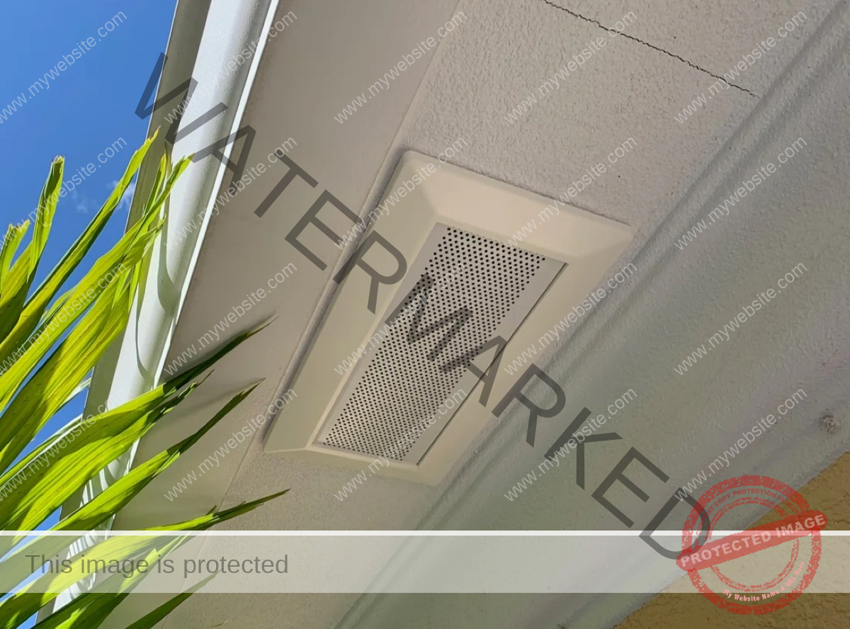 The attic ventilation soffit is installed below the ridge of the roof.