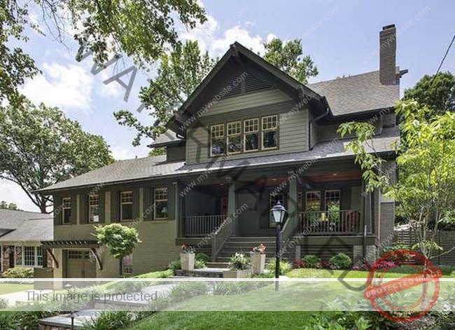 Olive green artisan house with front porch.