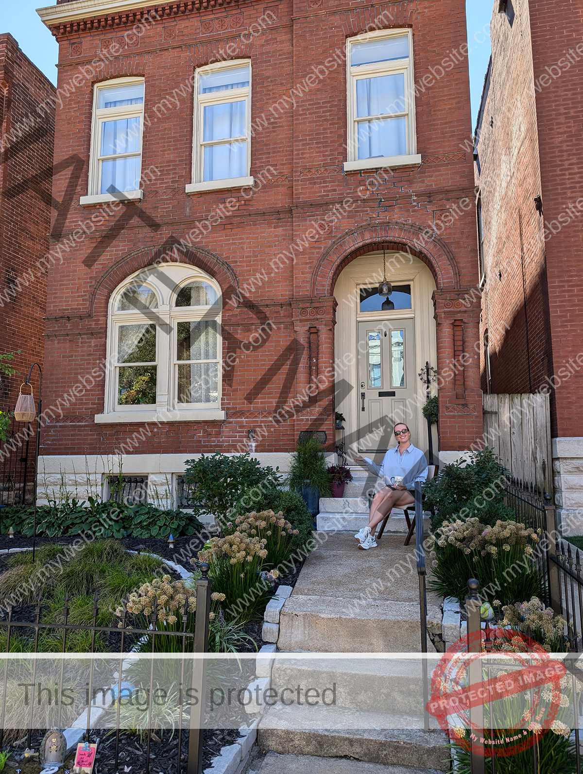 Emily M. in St. Louis sits on her front porch looking at the native plants she used in place of her traditional turf lawn.